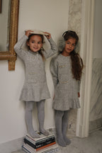 Two girls wearing the Charlie Knit Dress in Dove in the Canal House