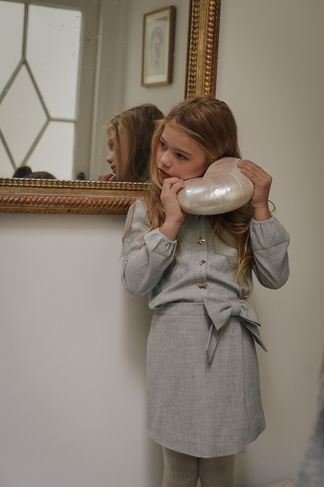 Girl wearing the Elle Blouse and Elle Skirt in Dove in the Canal House