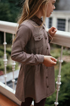 Side detail of the Isabella Dress in Houndstooth on the Canal House balcony