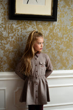 Girl wearing the Isabella Dress in Houndstooth in the Canal House
