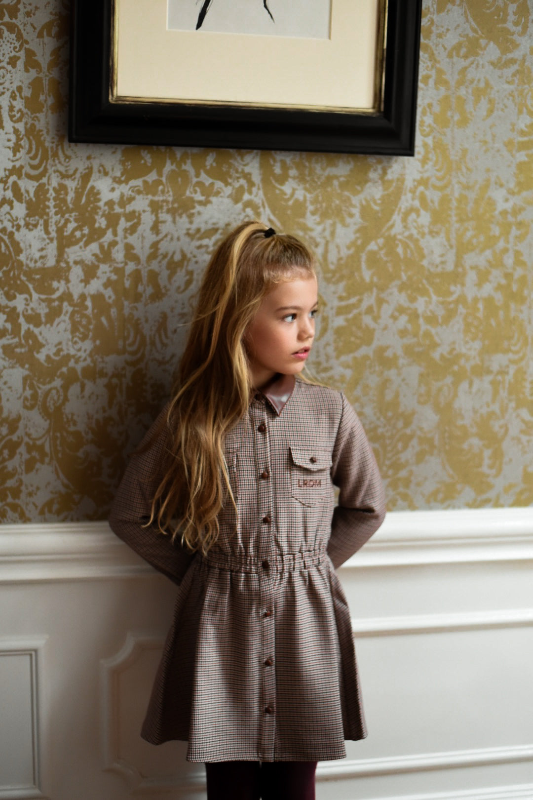 Girl wearing the Isabella Dress in Houndstooth in the Canal House