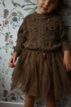 Girl wearing the Julie Tutu Skirt in Chocolate inside the Canal House