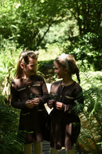 Two girls exploring the woodland in chocolate and ivory LRDM Petits dresses