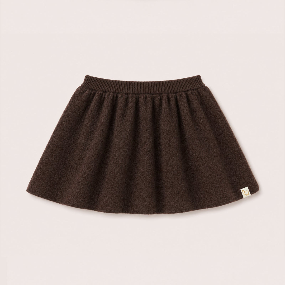 Charlie Knit Skirt in Chocolate on a neutral background