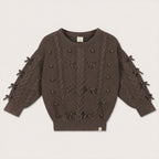 Elise Bow Pull in Chocolate with cable-knit bow details on a neutral background