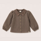 Elle Blouse in Chocolate on a neutral background