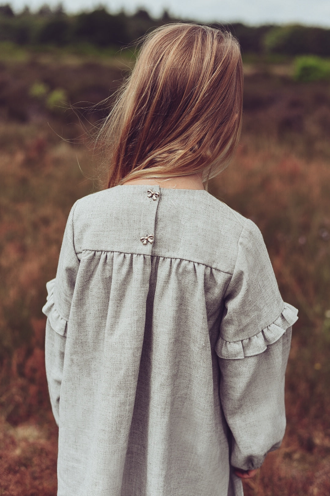 Close-up of the Elle Dress in Dove details on the heath