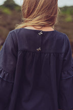 Close-up of the Elle Dress in Navy details on the heath