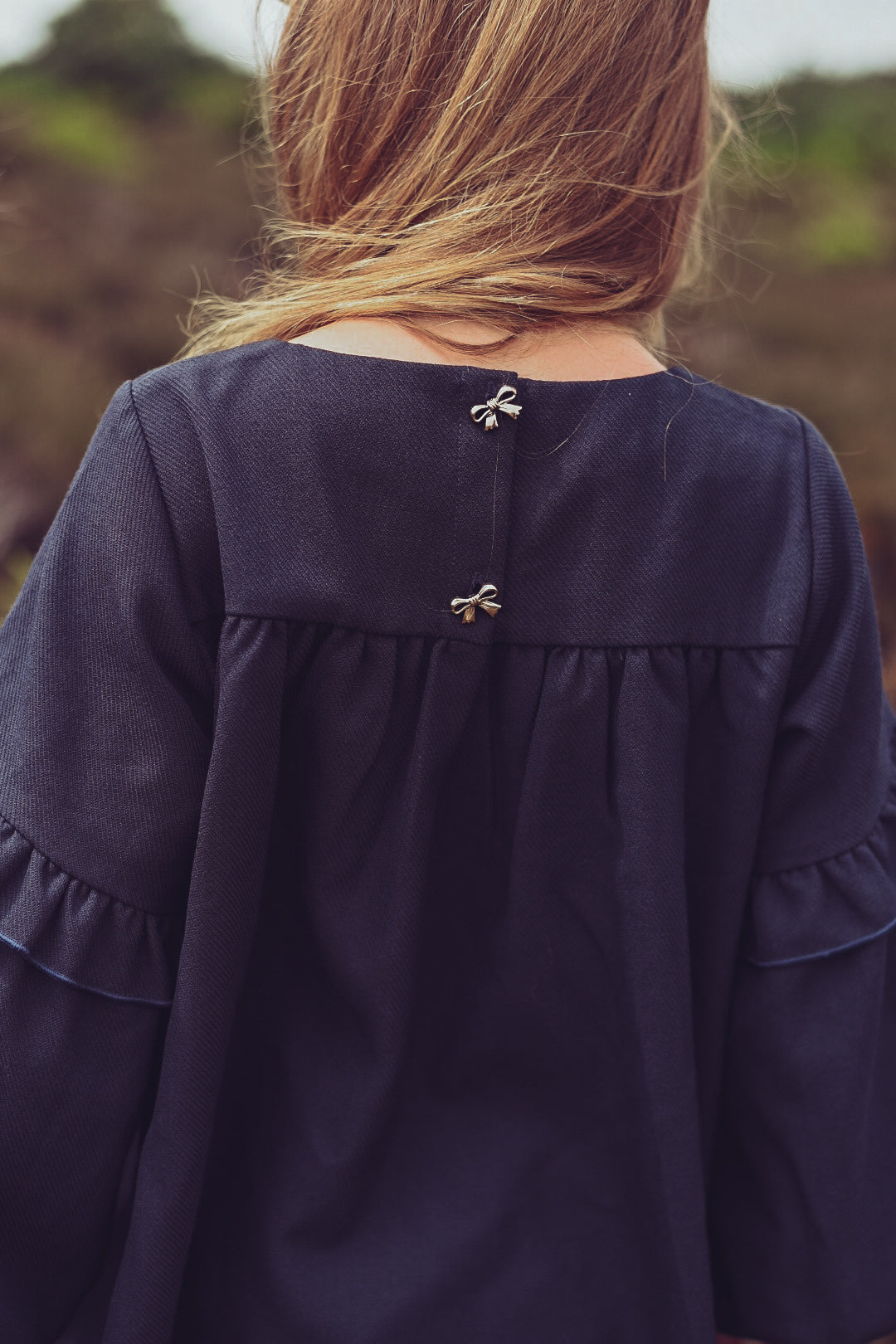 Close-up of the Elle Dress in Navy details on the heath