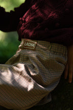Girl wearing the Isabella Skirt in the woodland