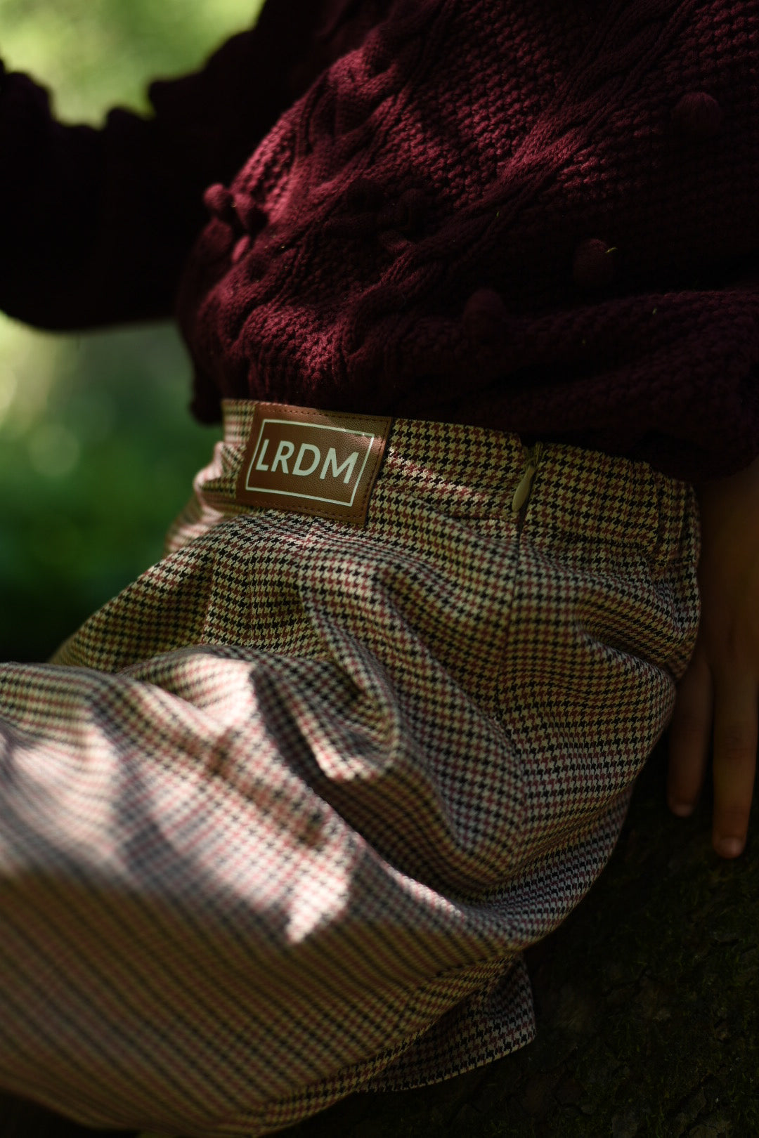 Girl wearing the Isabella Skirt in the woodland