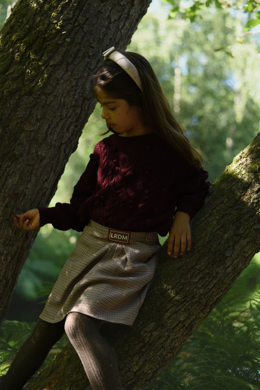Girl wearing the Isabella Skirt in the woodland