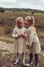 Girls wearing ivory Louise and Valery looks together on the heath