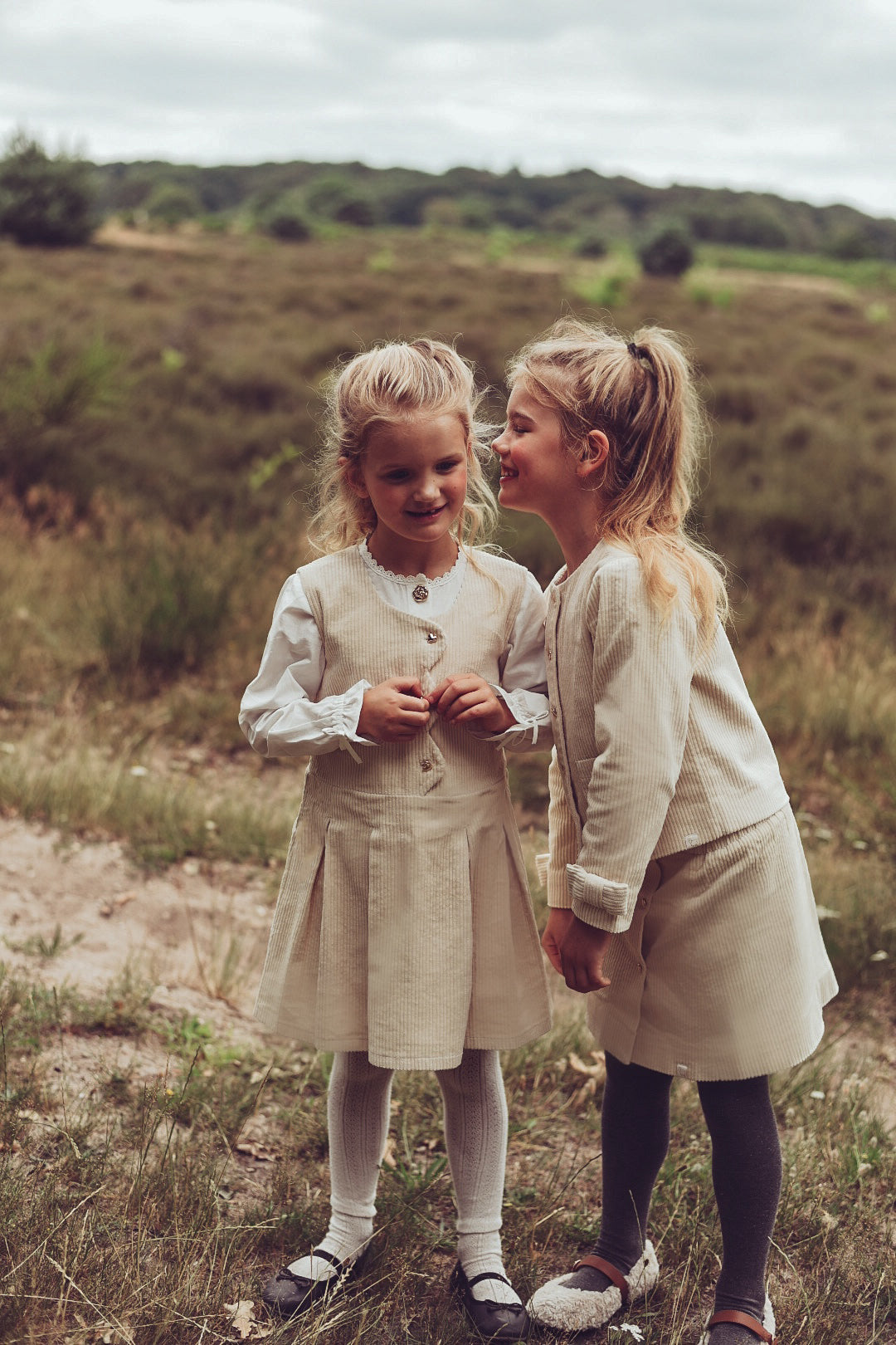 Girls wearing ivory Louise and Valery looks together on the heath