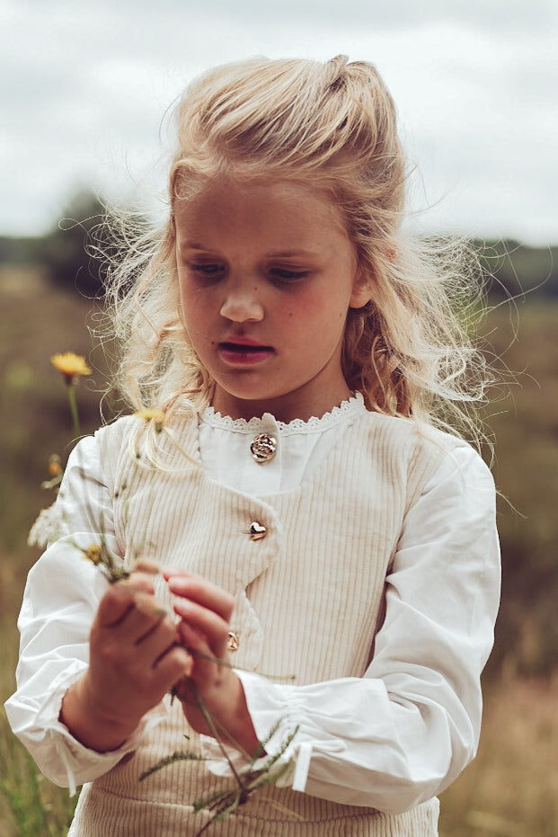 Girls wearing ivory Louise and Valery pieces on the heath