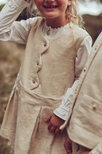 Girls wearing the ivory Louise Dress and white Valery Blouse on the heath
