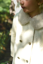 Close-up of the Mara Tweed Coat details in the woodland