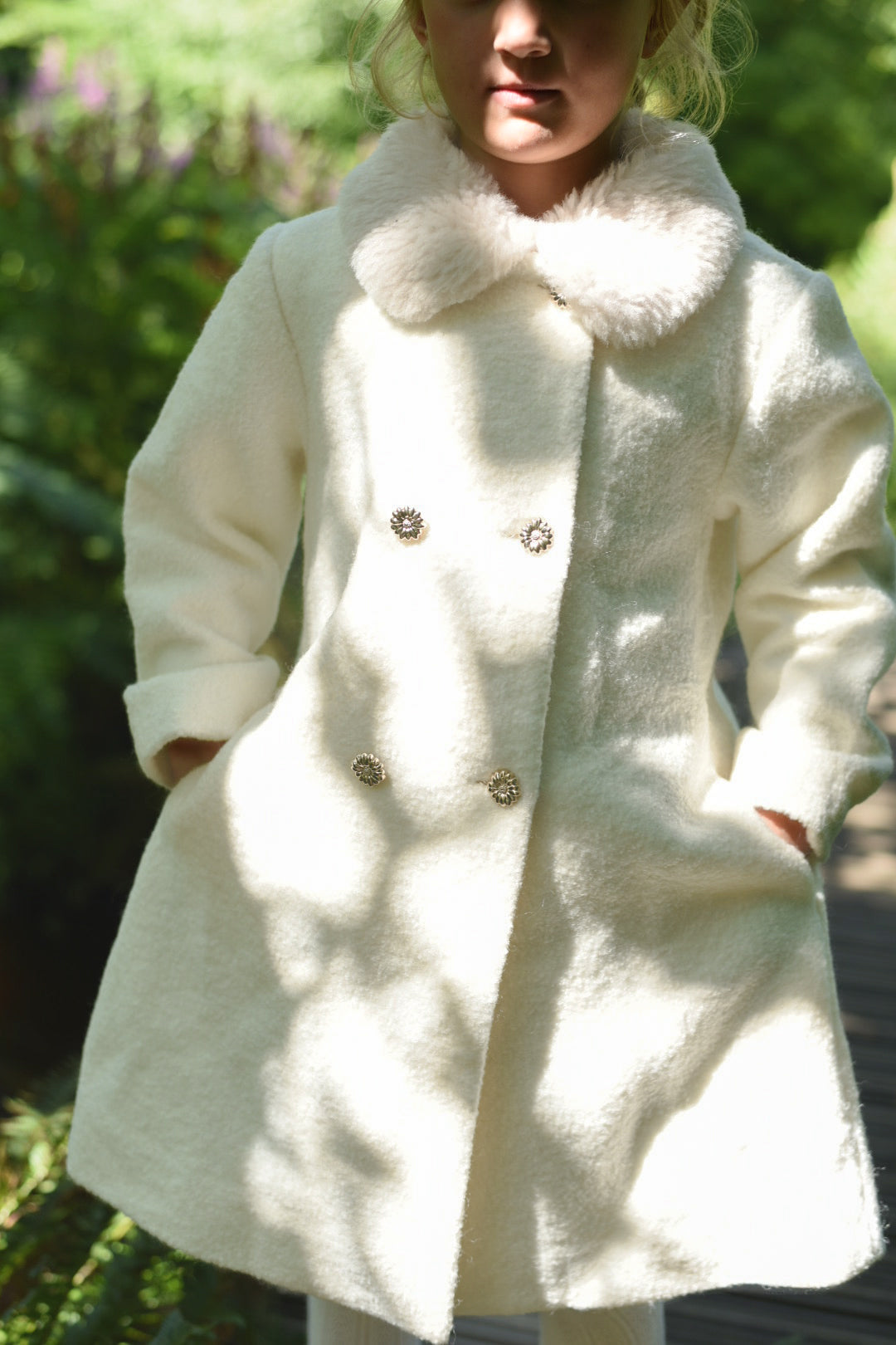 Girl wearing the Mara Tweed Coat in the woodland