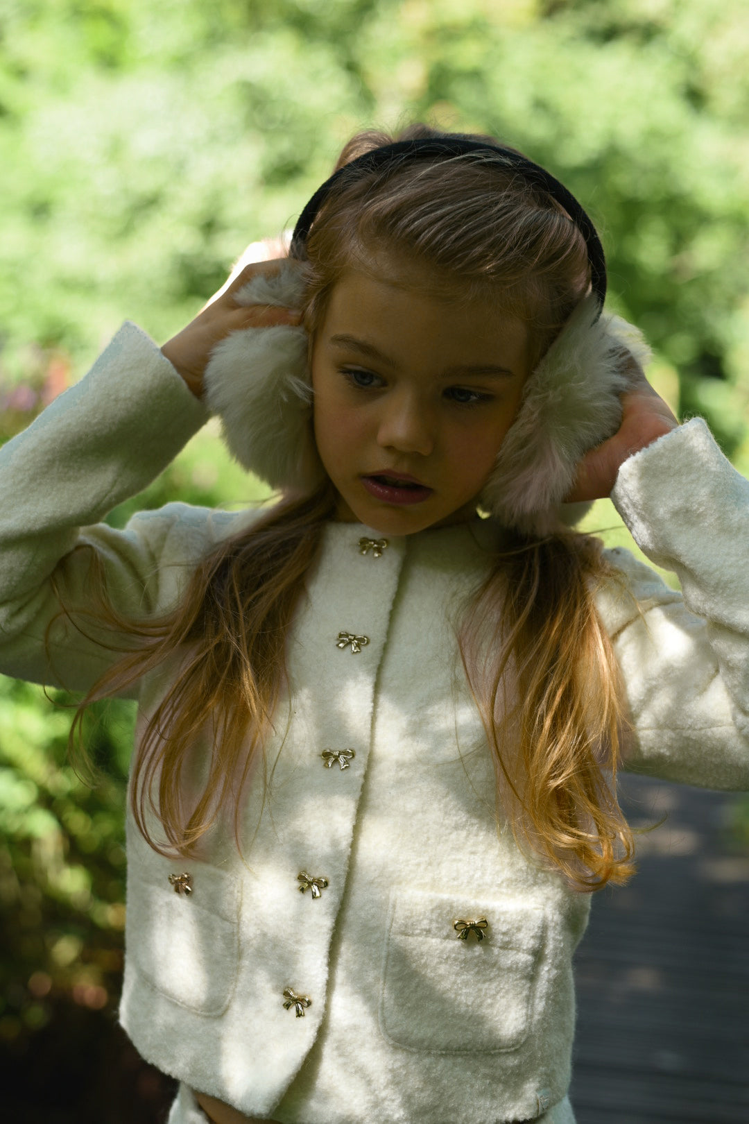 Close-up of the Mara Tweed Jacket details in the woodland