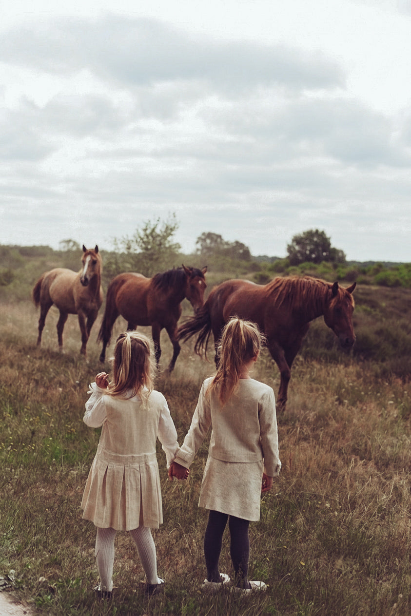 Two girls walking through the heath in LRDM Petits AW26