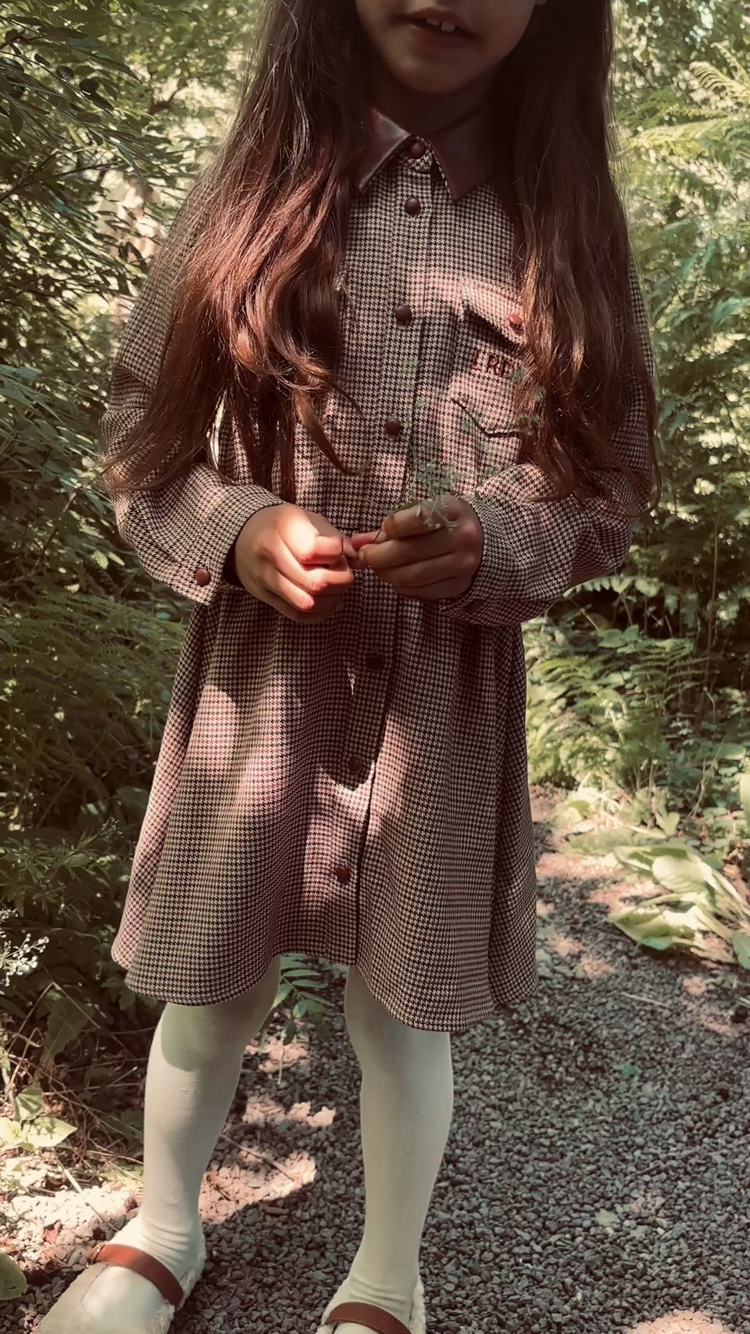 Girl wearing the Isabella Dress in Houndstooth in the woodland, LRDM AW26