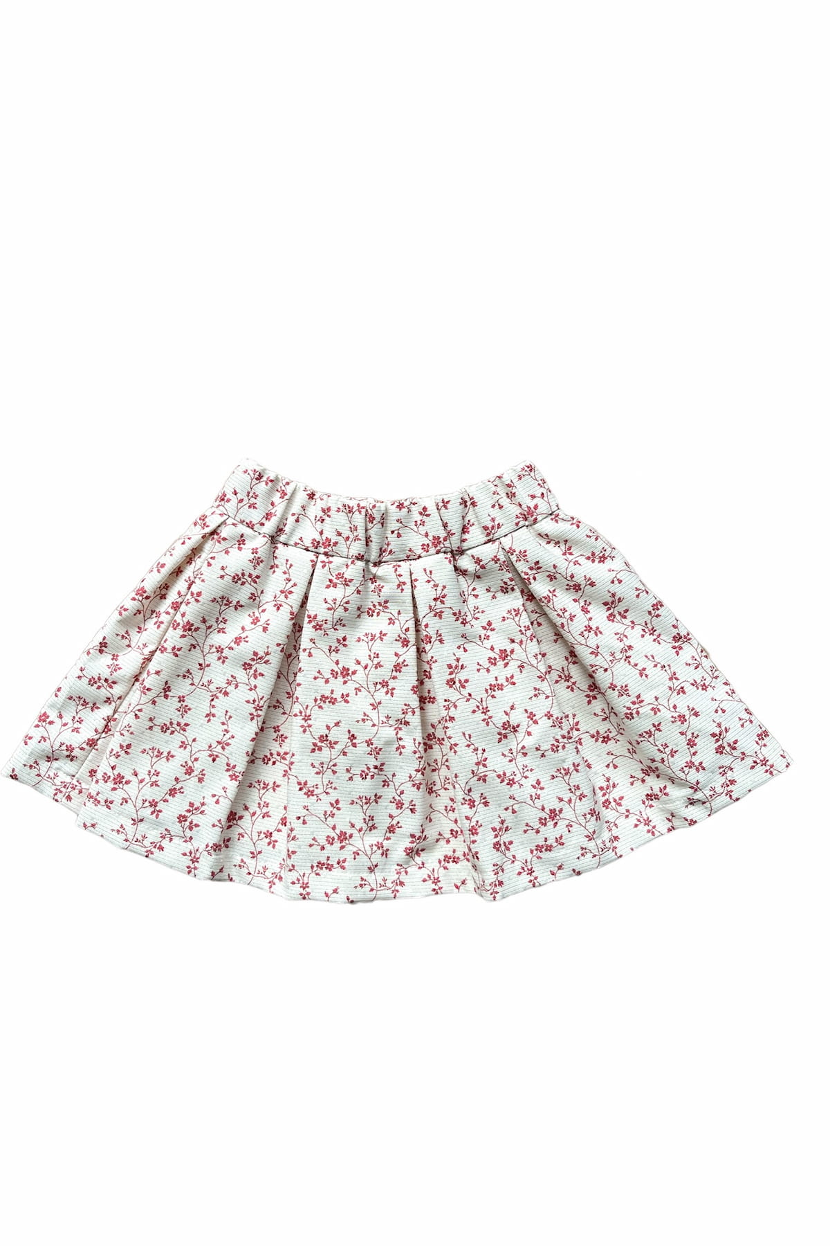 This beautifully pleated skirt is timeless and ideal for this time of year. The fabric has been selected in Paris and made from recycled cotton, thereby contributing to sustainability in the clothing industry. The perfect floral print and subtle lurex details make the fabric luxurious and elegant. 